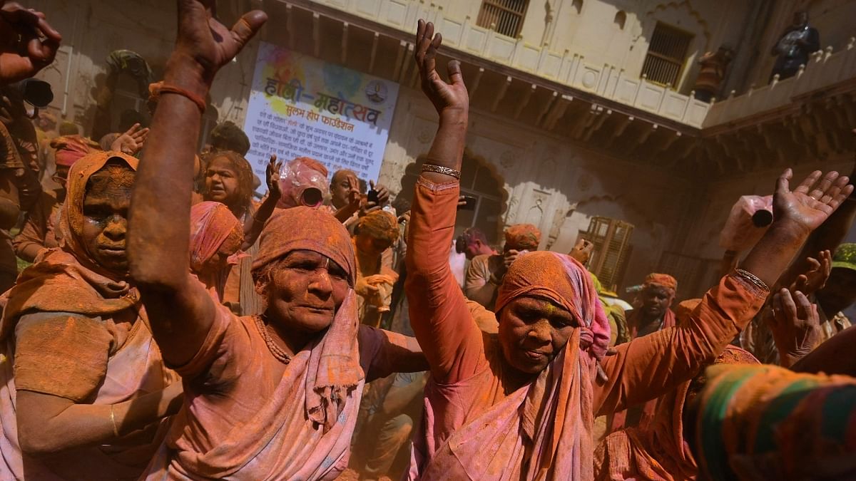 Dressed in white sarees, the widows danced, sang Rasiya (tradition Holi song of Brij) and smeared each other's faces with herbal 'gulal'. Credit: AFP Photo