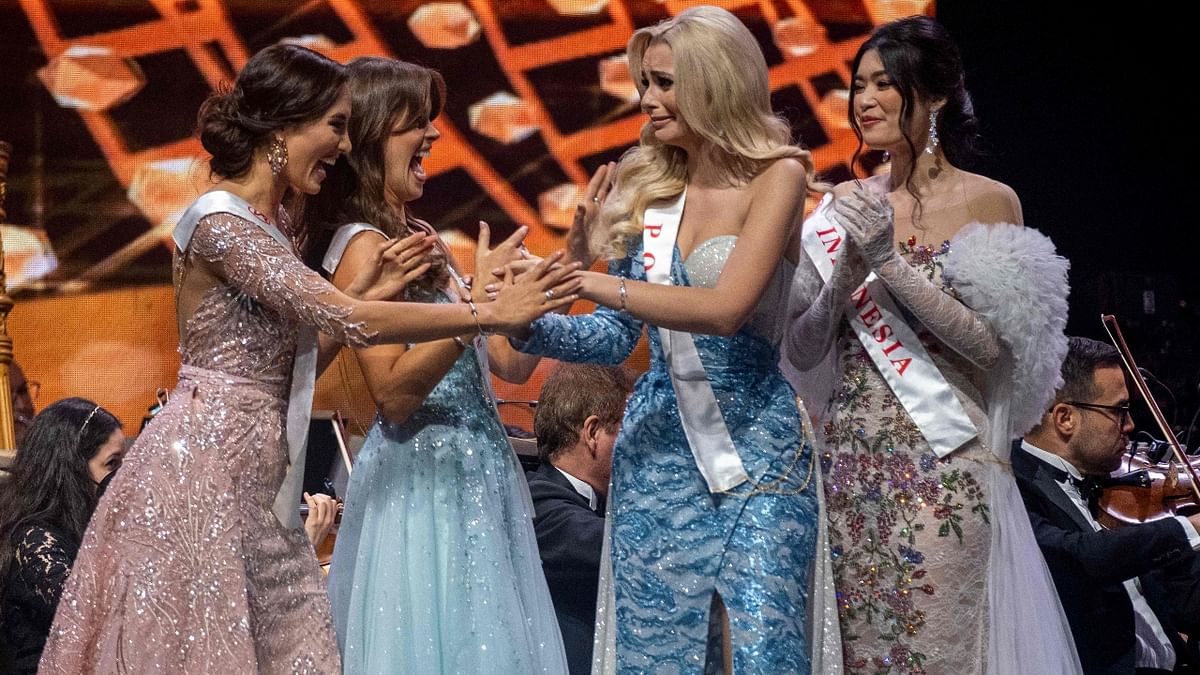 Bielawska is greeted by fellow participants after winning the 70th Miss World beauty pageant. Credit: AFP Photo