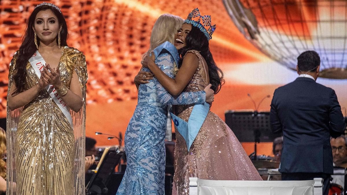 Pictured: Miss World 2019 Toni-Ann Singh congratulating Miss Poland Karolina Bielawska after winning the 70th Miss World beauty pageant. Credit: AFP Photo