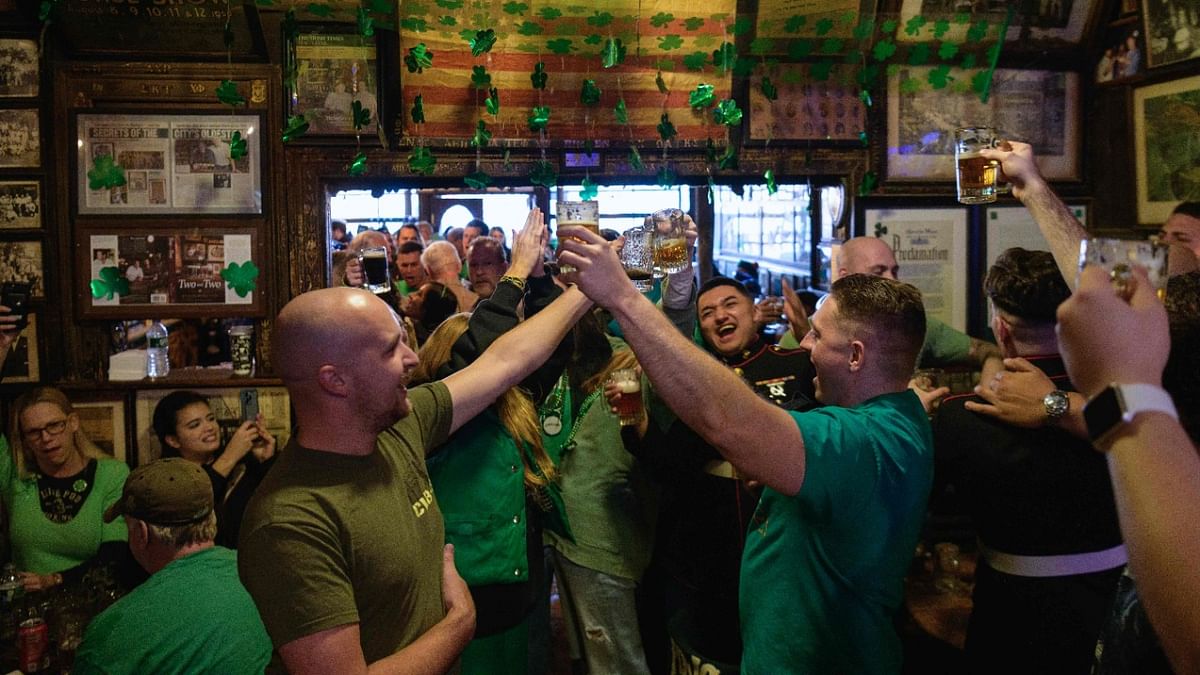 Customers cheer with beers at McSorley's Old Ale House on St. Patrick's Day in New York City. Credit: AFP Photo