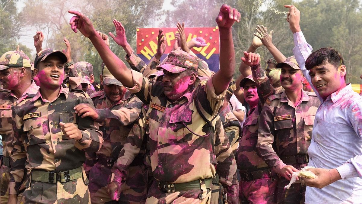 Jawans were also clicked dancing to the dhol beats while celebrate the festival of colour. Credit: AFP Photo
