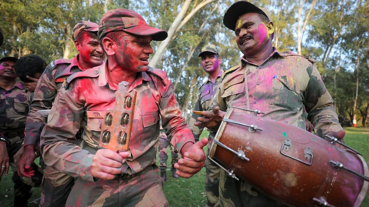 Daubed in colours BSF Jawans were seen celebrating the festival with great zeal. Credit: PTI Photo