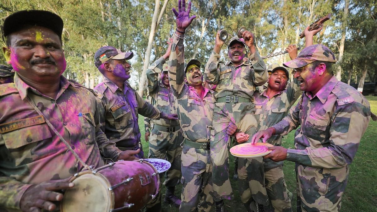 BSF Jawans sing and dance as they celebrate Holi in Jammu. Credit: PTI Photo