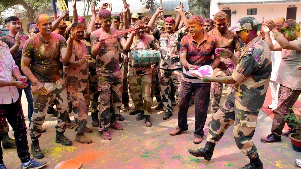 On the outskirts of Agartala, BSF Jawans were seen celebrating the festival with the Border Guard of Bangladesh. Credit: PTI Photo