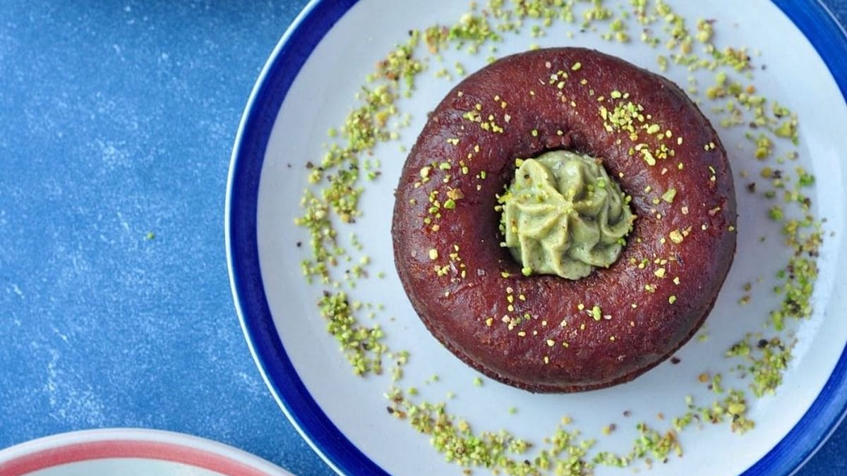 Gulab Nut: Fried in ghee, it is a gulab jamun shaped like a doughnut, soaked in old monk rum and has a rich delicious Pista cream filling. Credit: Instagram/thebombaycanteen