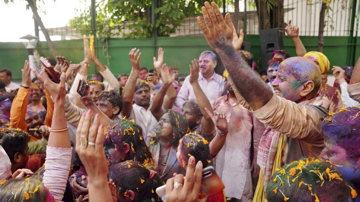 Deputy Chief Minister Manish Sisodia plays with colours, with his friends and family during the Holi celebrations at his residence, in New Delhi. Credit: Twitter/@msisodia
