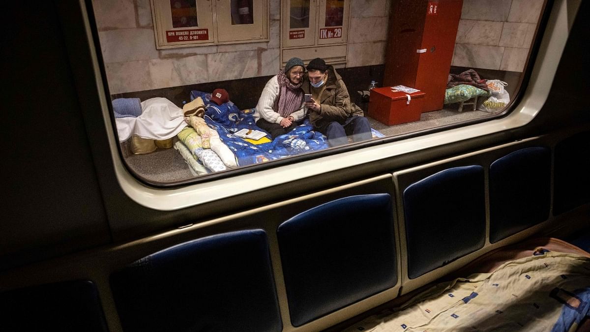 Residents take refuge in a metro station, being used as bomb shelter in Kyiv. Credit: AFP Photo