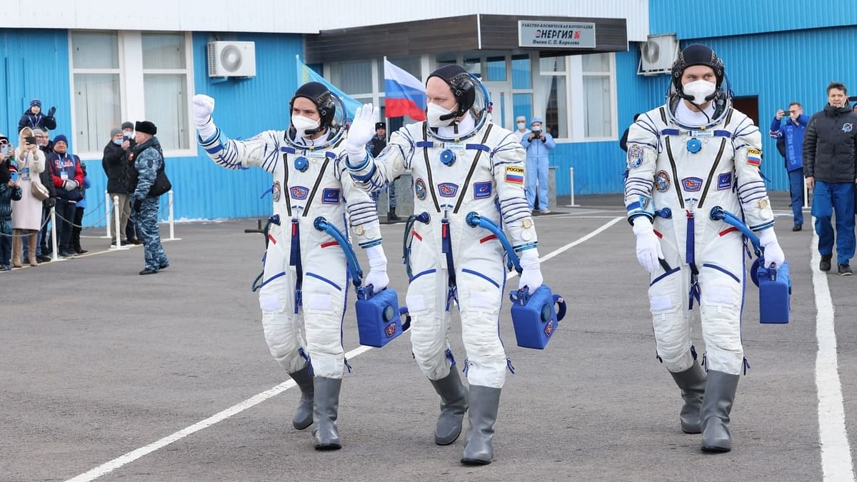 The International Space Station (ISS) crew of Russian cosmonauts Oleg Artemyev, Denis ?atveev and Sergei Korsakov walk before boarding the Soyuz MS-21 spacecraft prior to the launch at the Russian-leased Baikonur cosmodrome in Kazakhstan. Credit: AFP Photo