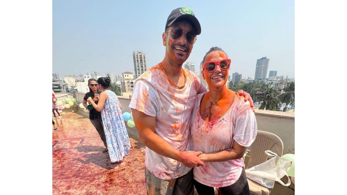 Actor-couple Neha Dhupia and Angad Bedi celebrate Holi. Sharing the pictures, Neha wrote, “The best kinda mess! From ours to yours. #happyholi.” Credit: Instagram/@nehadhupia