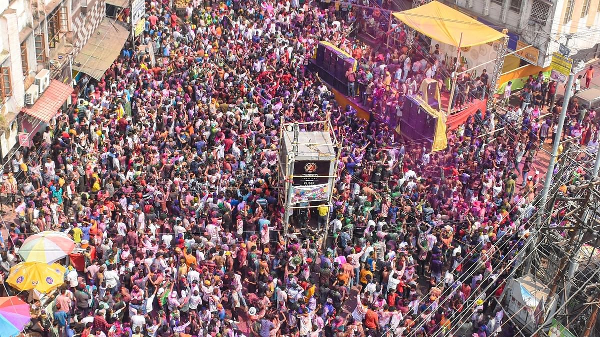 Hundreds of people gathered at Fancy Bazar, in Guwahati to celebrate Holi. Credit: PTI Photo