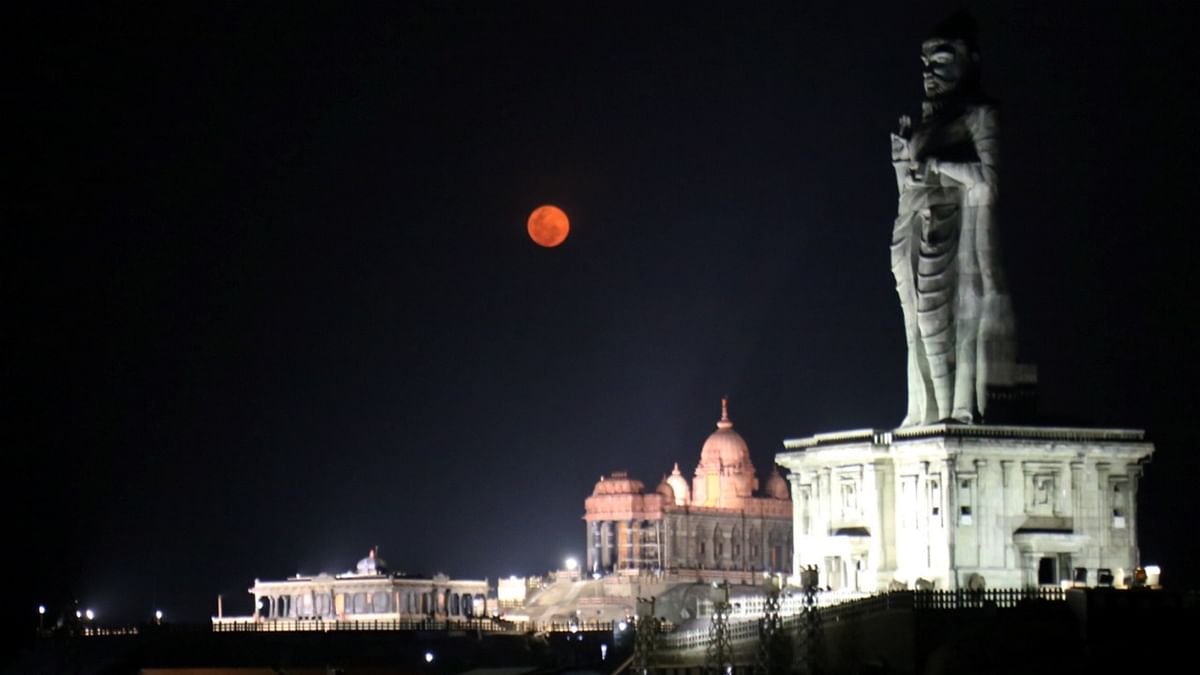 A view of a reddish full moon on the occasion of 'Panguni Uthiram' at the Tri-Sea point, in Kanyakumari. Credit: PTI Photo