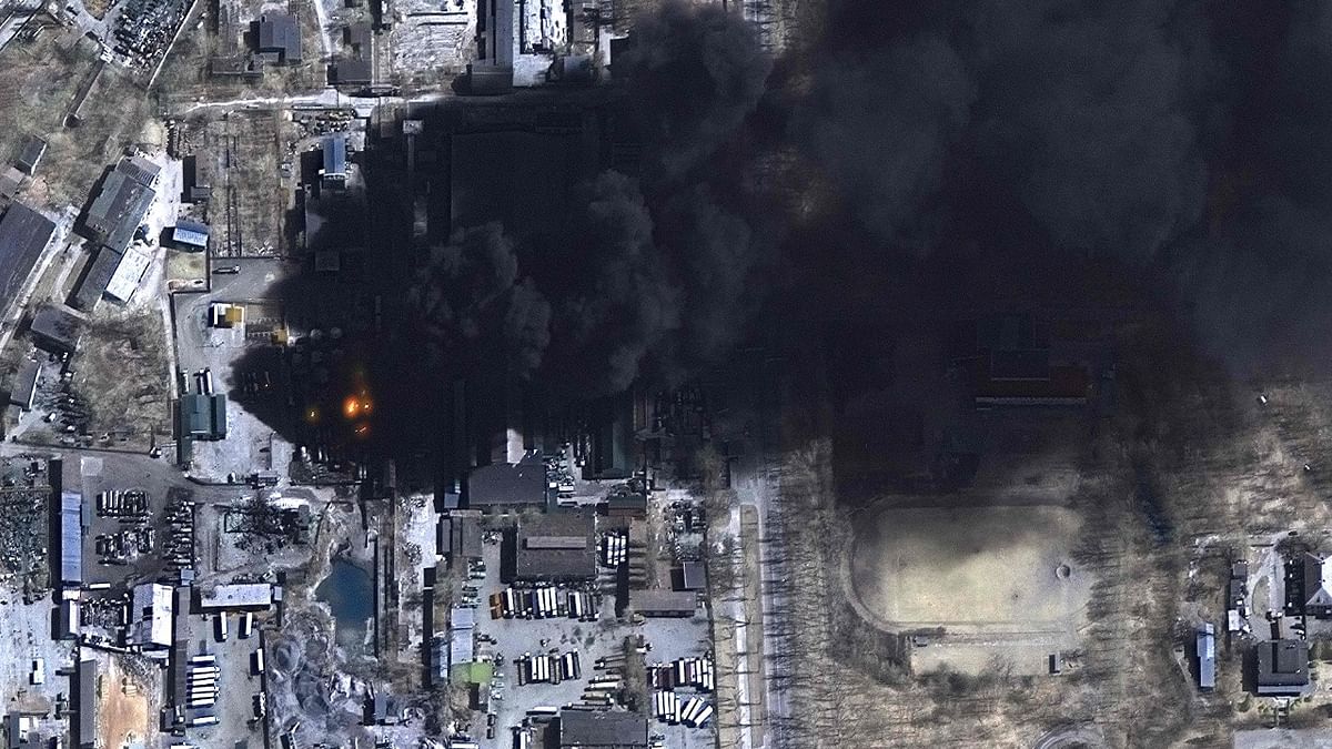 This handout satellite image released by Maxar Technologies shows a closer overview multispectral image of burning oil storage tanks and industrial area in Chernihiv, Ukraine. Credit: AFP Photo