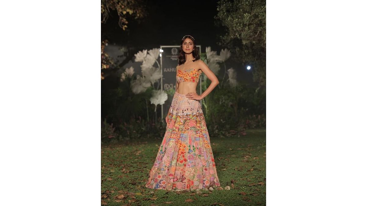 A model wears a Rahul Mishra outfit embellished with his signature floral motifs. Credit: Instagram/fdciofficial
