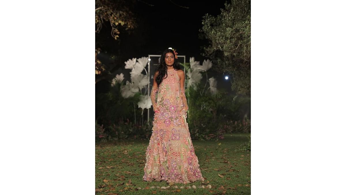 Two and three-dimensional embellishments of Himalayan poppies, fox gloves and calla lilies come alive in Rahul Mishra’s line. Credit: Instagram/fdciofficial