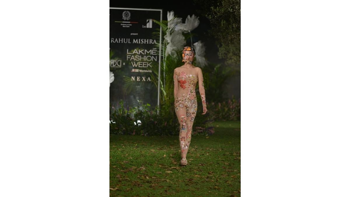 A model sizzles in a sheer catsuit strategically embroidered with leaves and flowers. Credit: Subhash Barolia