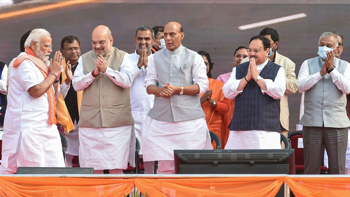 Prime Minister Narendra Modi exchanges greetings with Union Home Minister Amit Shah, Defence Minister Rajnath Singh and BJP National president J P Nadda. Credit: PTI Photo