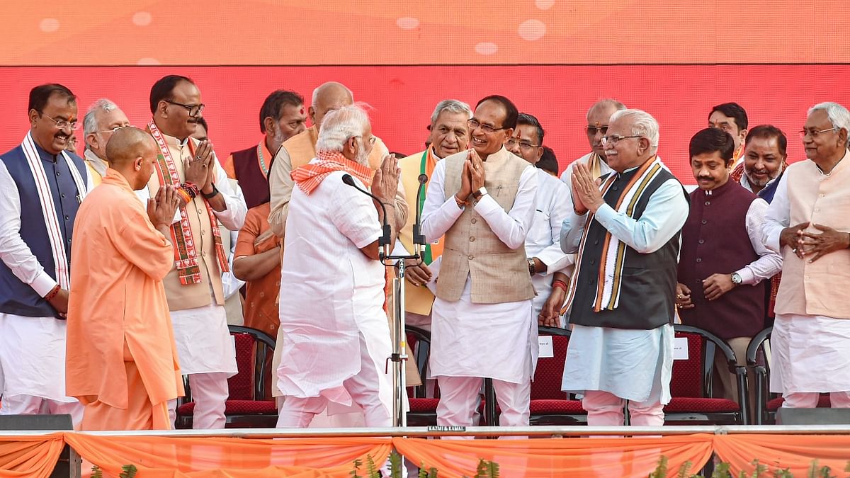 Political bigwigs greet UP CM Yogi and PM Narendra Modi. Credit: PTI Photo