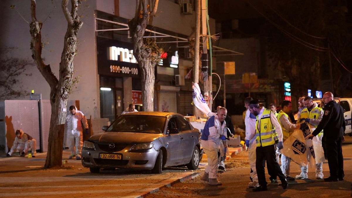 Israeli security forces gather at the site of an attack that left two Israeli police dead in the northern city of Hadera. Credit: AFP Photo