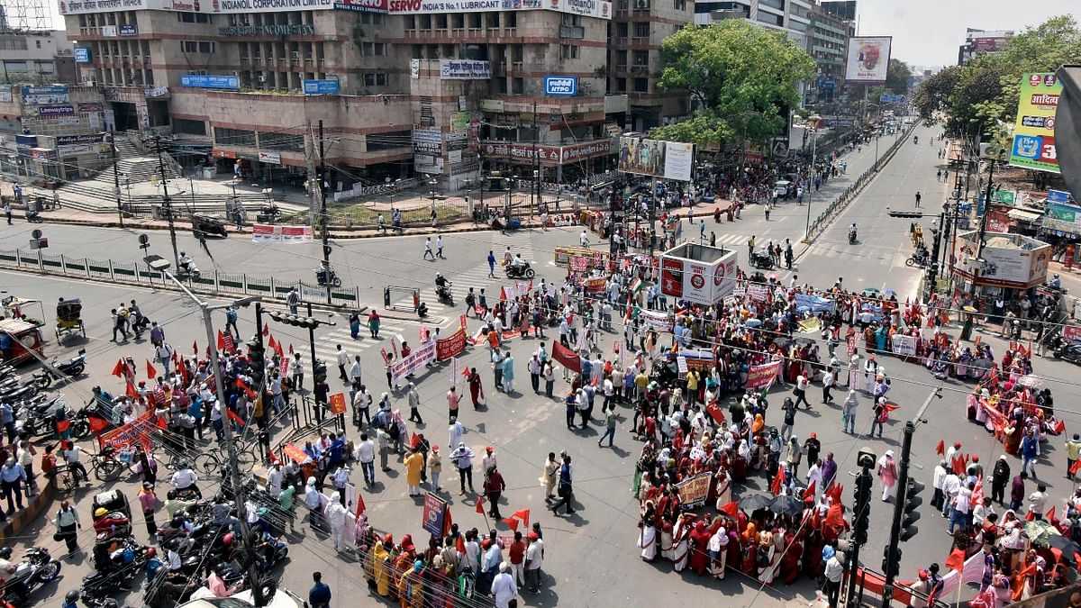 Hundreds of Left trade union members blocked the Dak Bungalow Road in support of the two-day Bharat Bandh, in Patna. Credit: PTI Photo