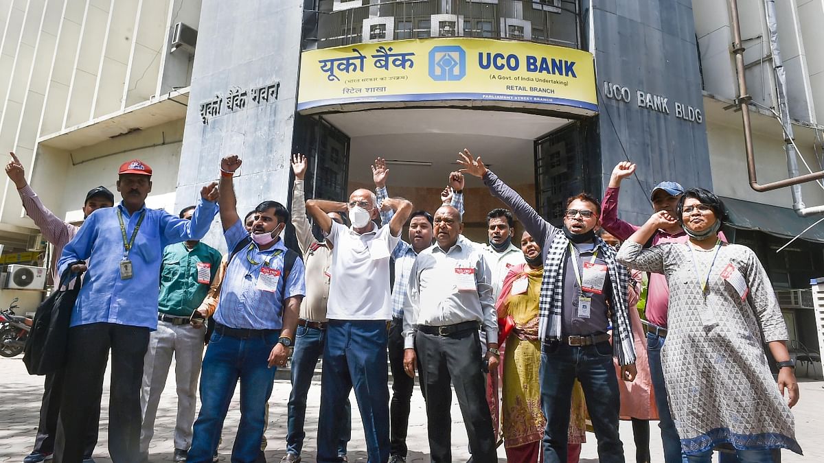 Employees of the UCO Bank raise slogans in protest during 'Bharat Bandh' in New Delhi. Credit: PTI Photo