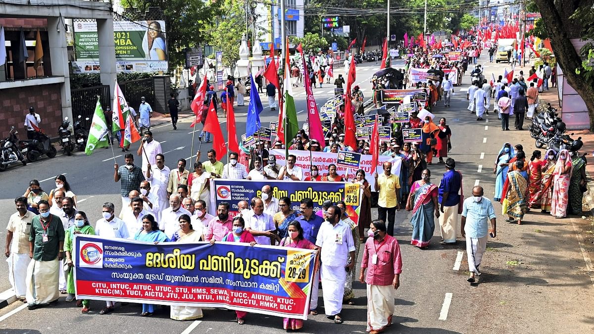 Left trade union members are seen staging a protest against the Centre's policies that are allegedly affecting farmers and workers, in Thiruvananthapuram, Kerala. Credit: PTI Photo