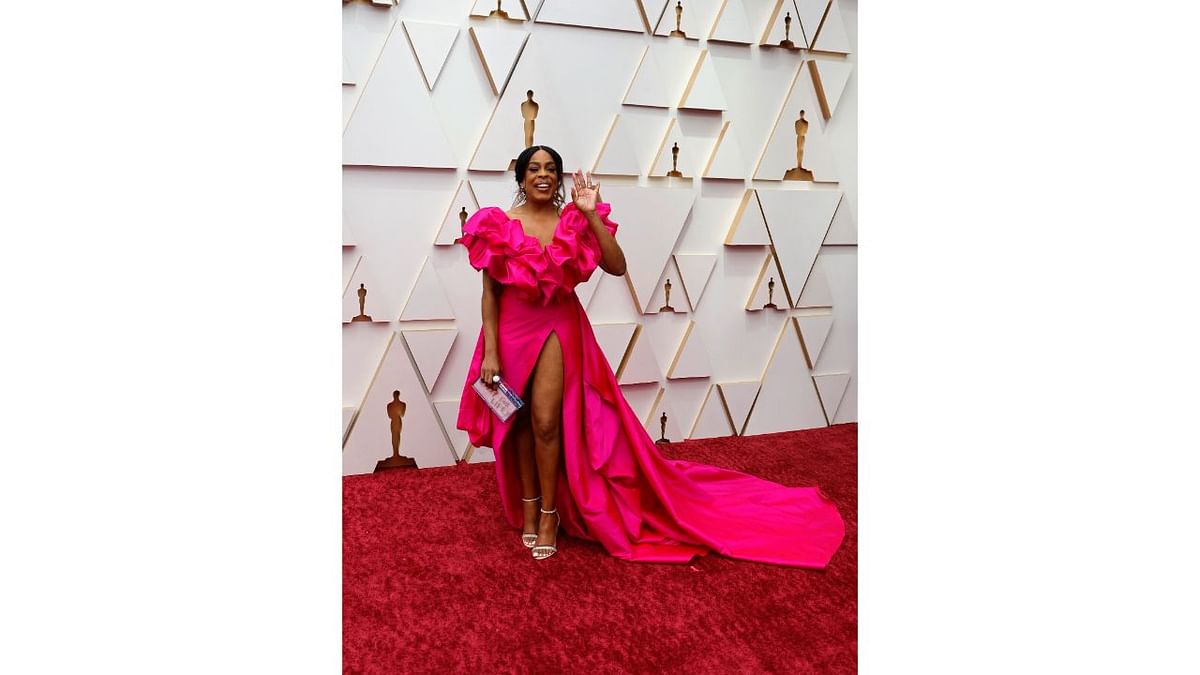 Jessica Betts  upped her fashion game with a pink Monsoori dress and a dramatic, thigh-high slit. Credit: Reuters Photo