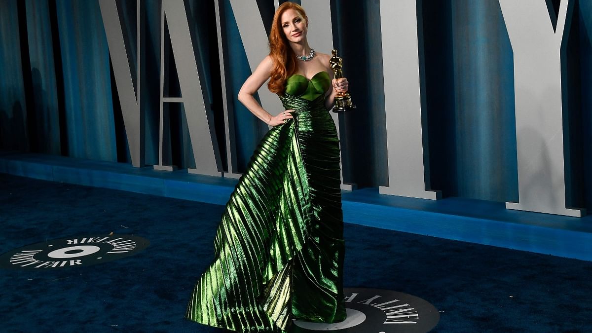 Jessica Chastain, who won the best actress at the 94th Academy Awards, wore a custom emerald gown by Gucci. Credit: AFP Photo