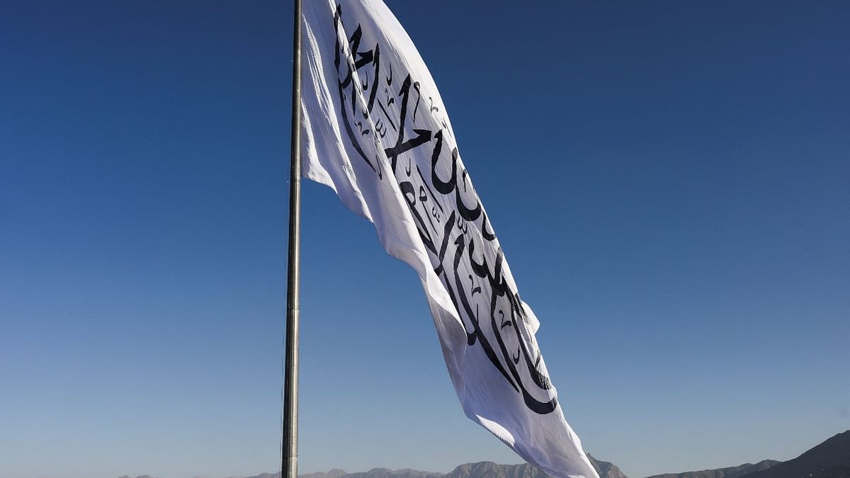 The Taliban raised a giant white flag of their movement on a hill overlooking the Afghan capital on March 31 in a ceremony held nearly eight months after they returned to power. Credit: Reuters Photo