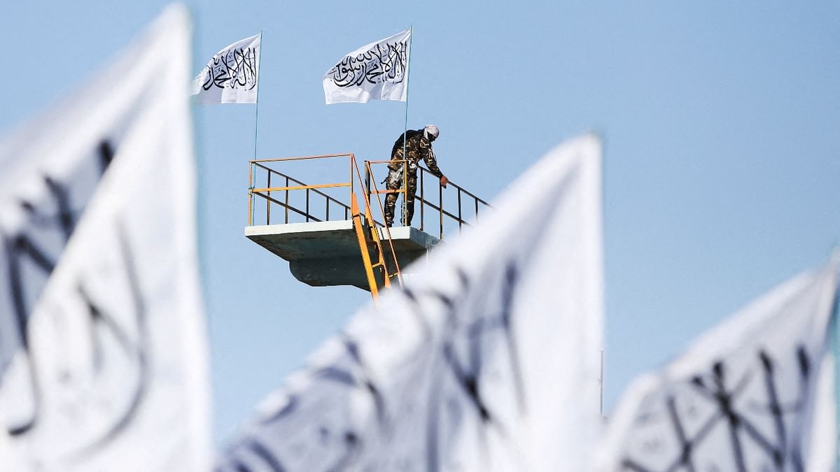 A Taliban fighter is seen at the Taliban flag-raising ceremony in Kabul, Afghanistan. Credit: Reuters Photo