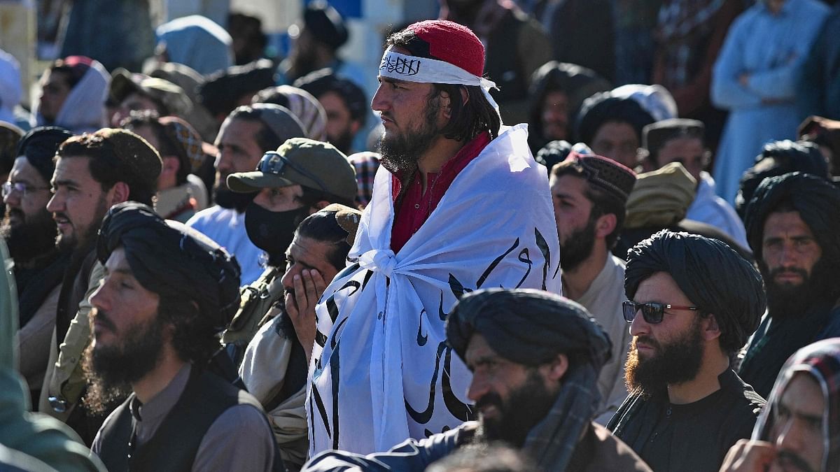 Several hundred Taliban, many armed, attended the ceremony presided over by Abdul Salam Hanafi, a deputy prime minister, on the hill in Wazir Akbar Khan, near the mostly deserted diplomatic enclave in Kabul. Credit: AFP Photo
