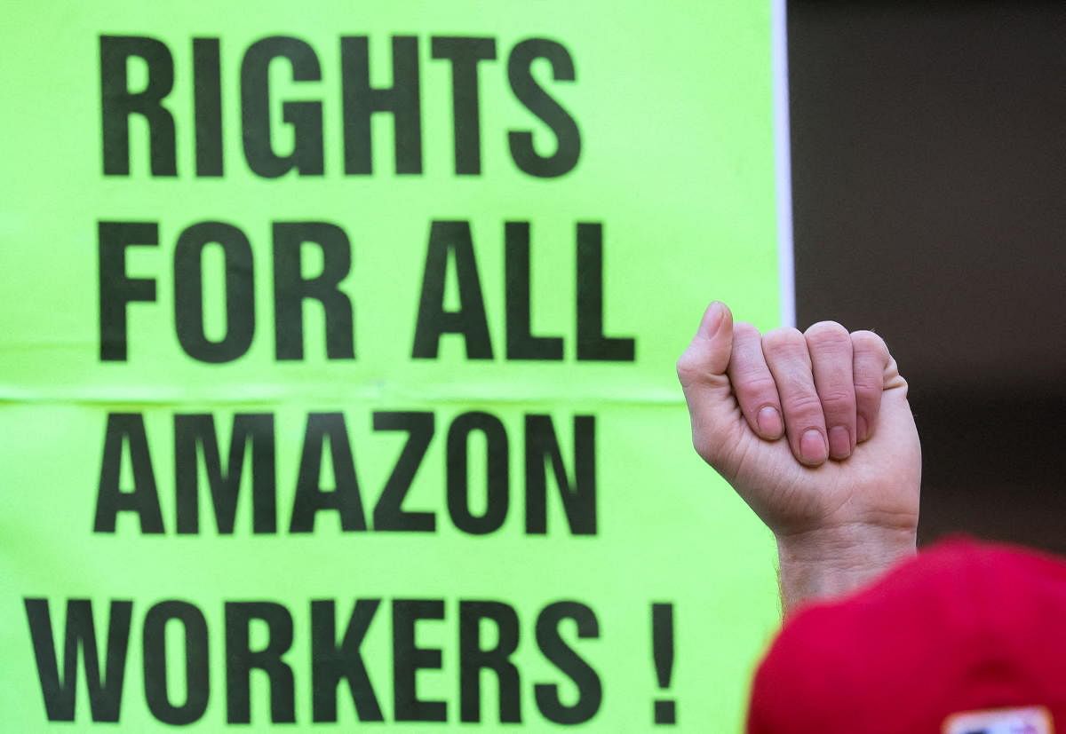 Amazon.com Inc workers react to the outcome of the vote to unionize, in Brooklyn. Credit: Reuters Photo