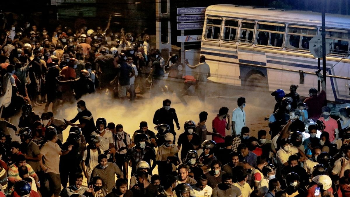 Police used tear gas and water cannons to disperse crowds near Rajapaksa's residence on Thursday, after they torched several police and army vehicles. Credit: Reuters photo