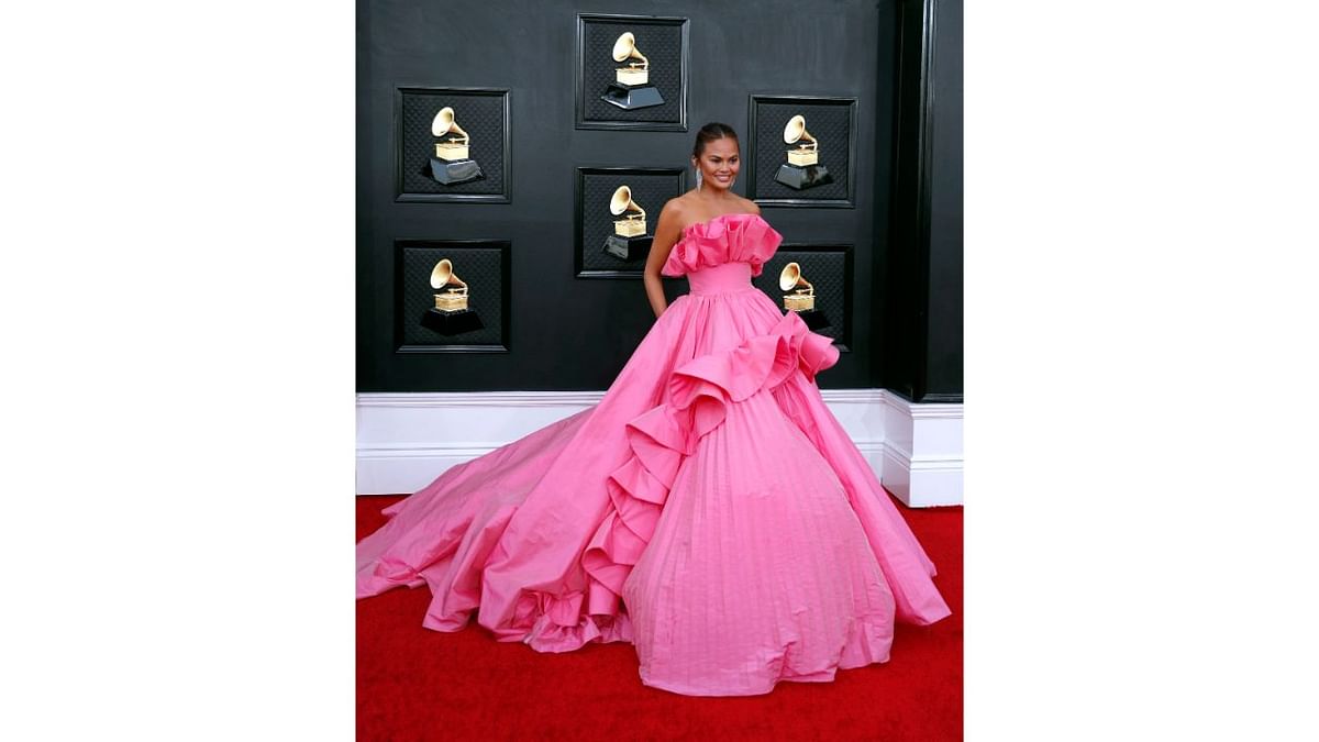 Chrissy Teigen set the red carpet on fire in a pink gown. Credit: Reuters Photo