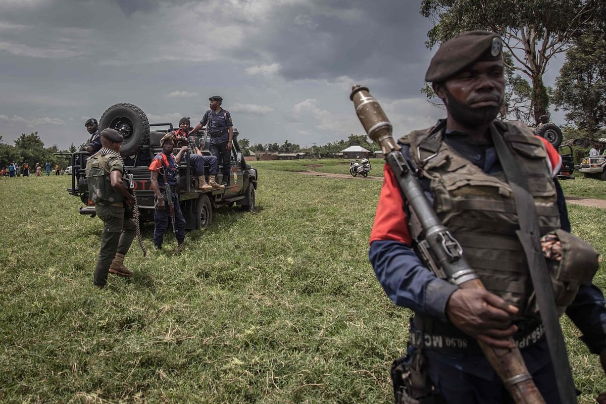 A soldier of the Democratic Republic of Congo's armed forces holds his weapon during a security patrol around the Kiwanja airfield days after clashes with the M23 rebels in Rutshuru. Credit: AFP Photo