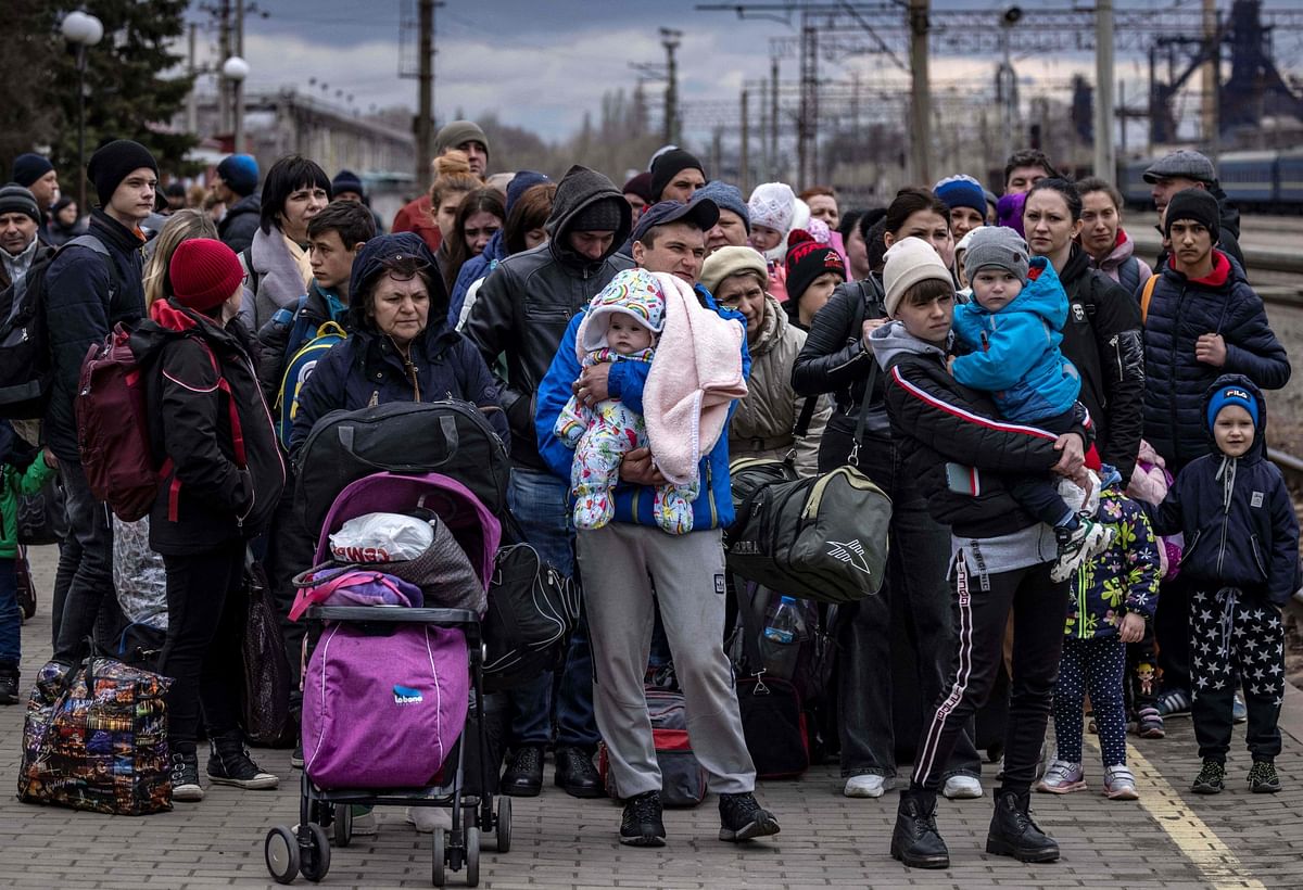 Families arrive at the main train station as they flee the eastern city of Kramatorsk, in the Donbass region. Credit: AFP Photo