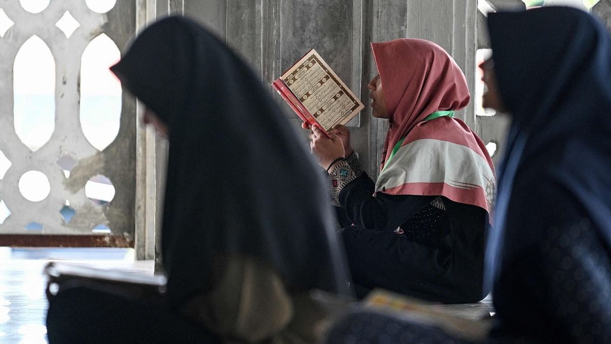People read copies of the Quran at the Baitussalihin mosque in Banda Aceh, as Muslims worldwide start the holy month of Ramadan. Credit: AFP Photo