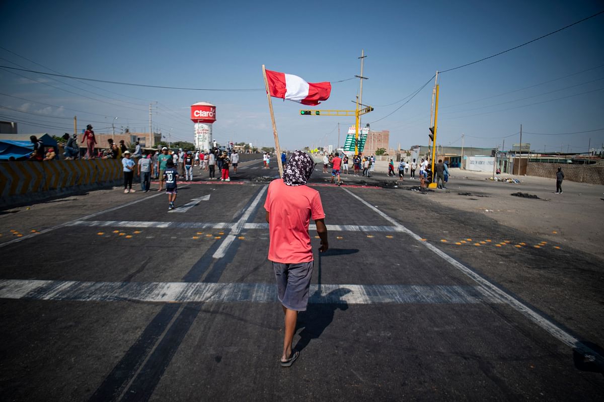Demonstrators block the Pan-American highway during a partial strike of cargo and passenger carriers, in Ica, in southern Peru. Credit: AFP Photo