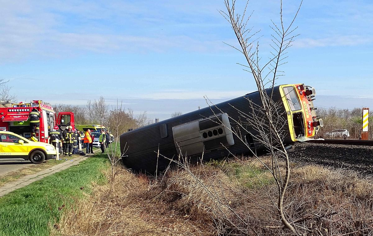 A train lays in a ditch after derailing following a crash with a car close to Mindszent, 140 kilometres (86 miles) southeast of Budapest. Credit: AFP Photo