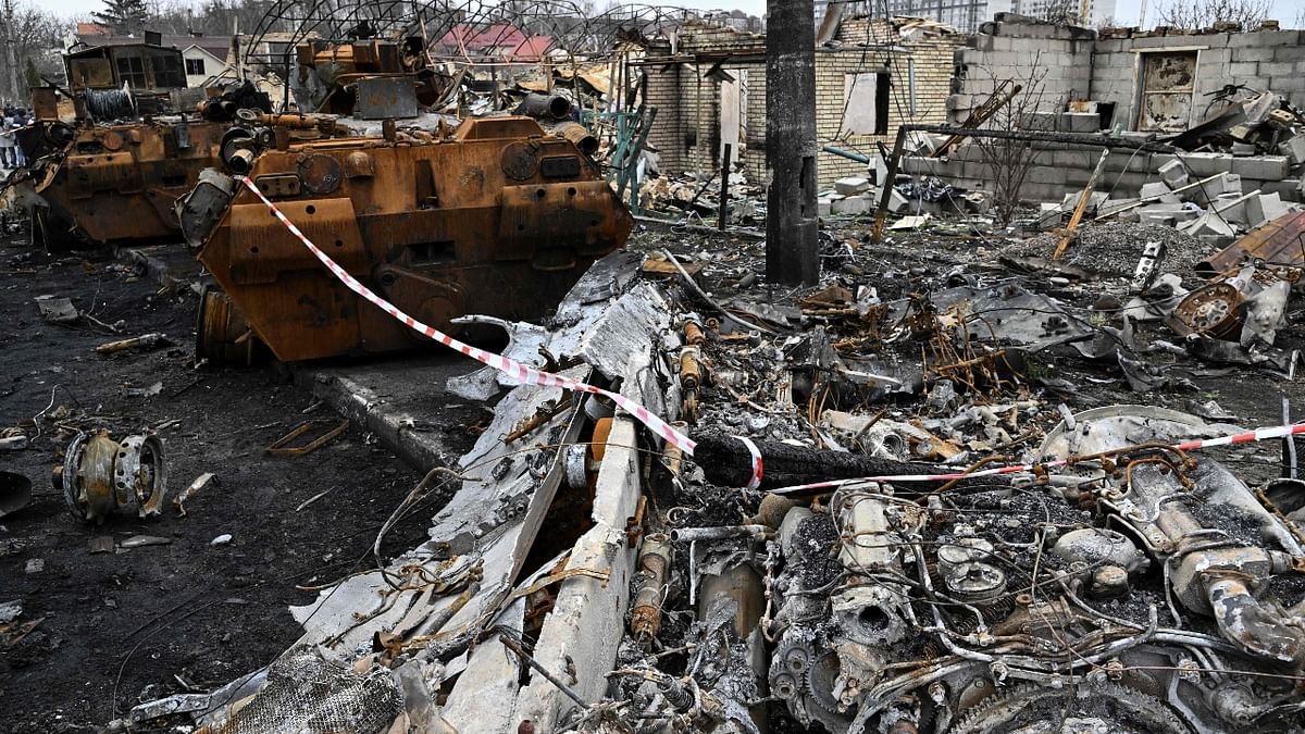 Debris of destroyed armoured vehicles is seen on a street in the town of Bucha. Credit: AFP Photo