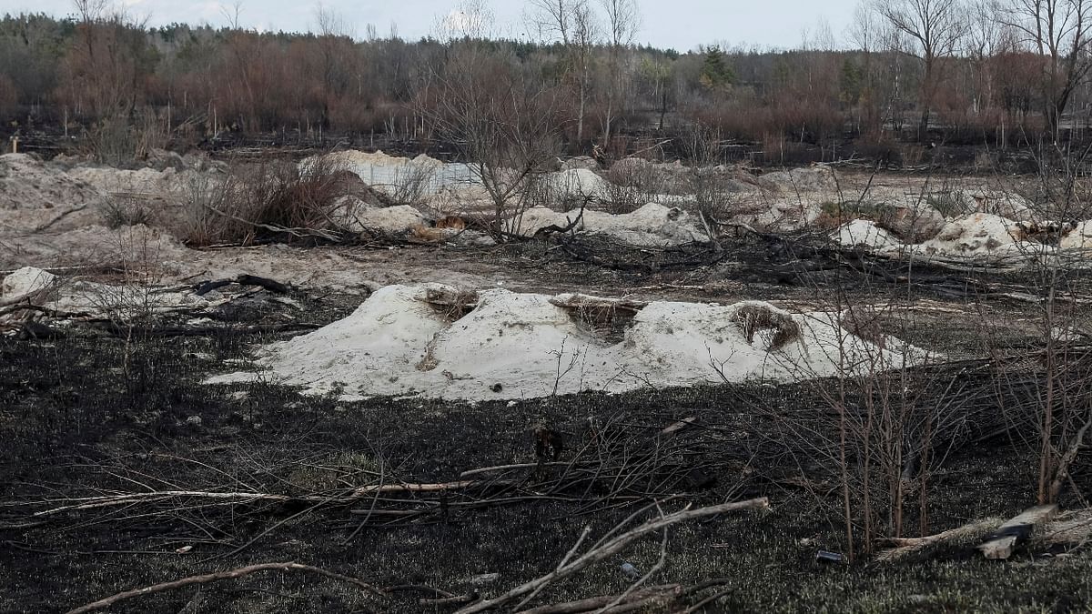 Trenches dug by the Russian military are seen in an area with high levels of radiation near the Chernobyl Nuclear Power Plant. Credit: Reuters Photo