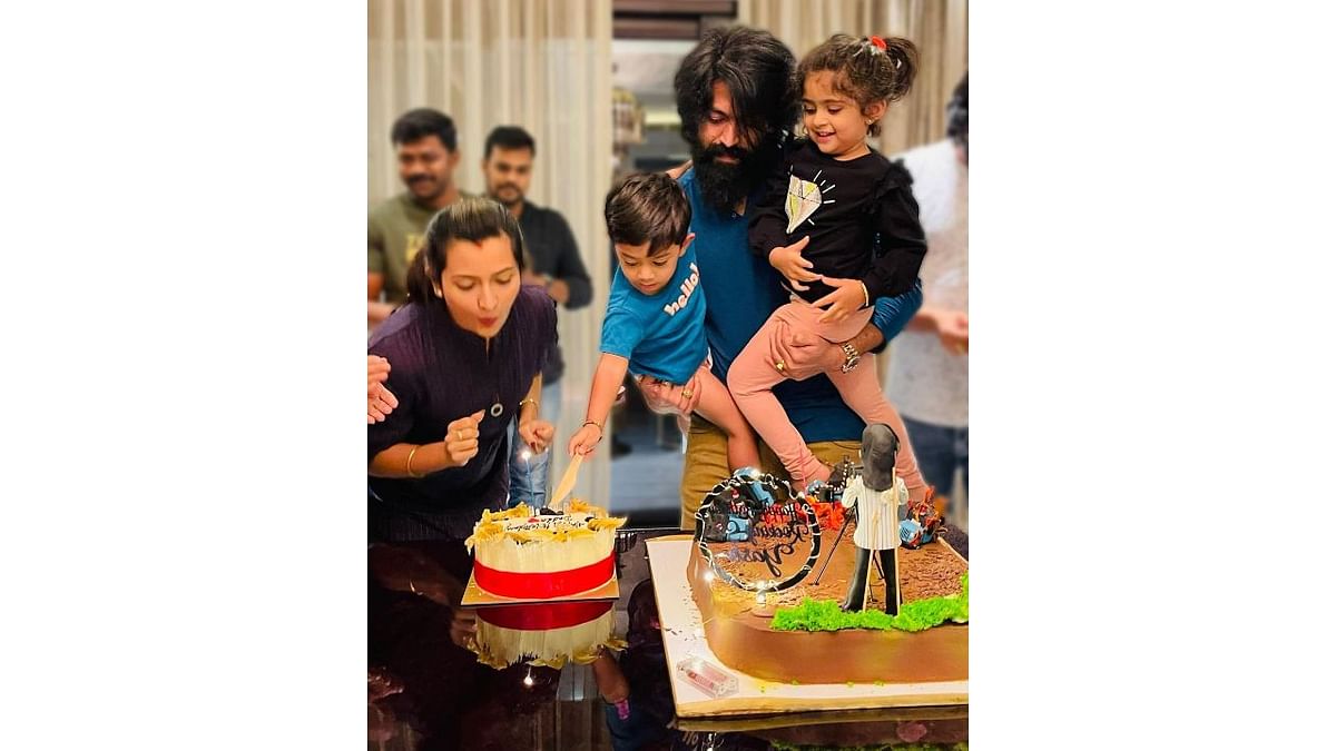 Despite his busy schedule, Yash makes sure he is there for his family. In this photo, Yash is seen holding his children while cutting a cake for his 36th birthday celebrations. Credit: Instagram/thenameisyash
