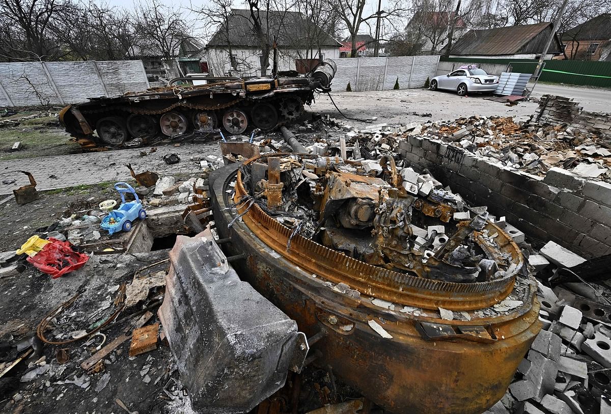 The debris of a destroyed Russian tank is seen in the yard of a house in Bohdanivka village, northeast of Kyiv. Credit: AFP Photo