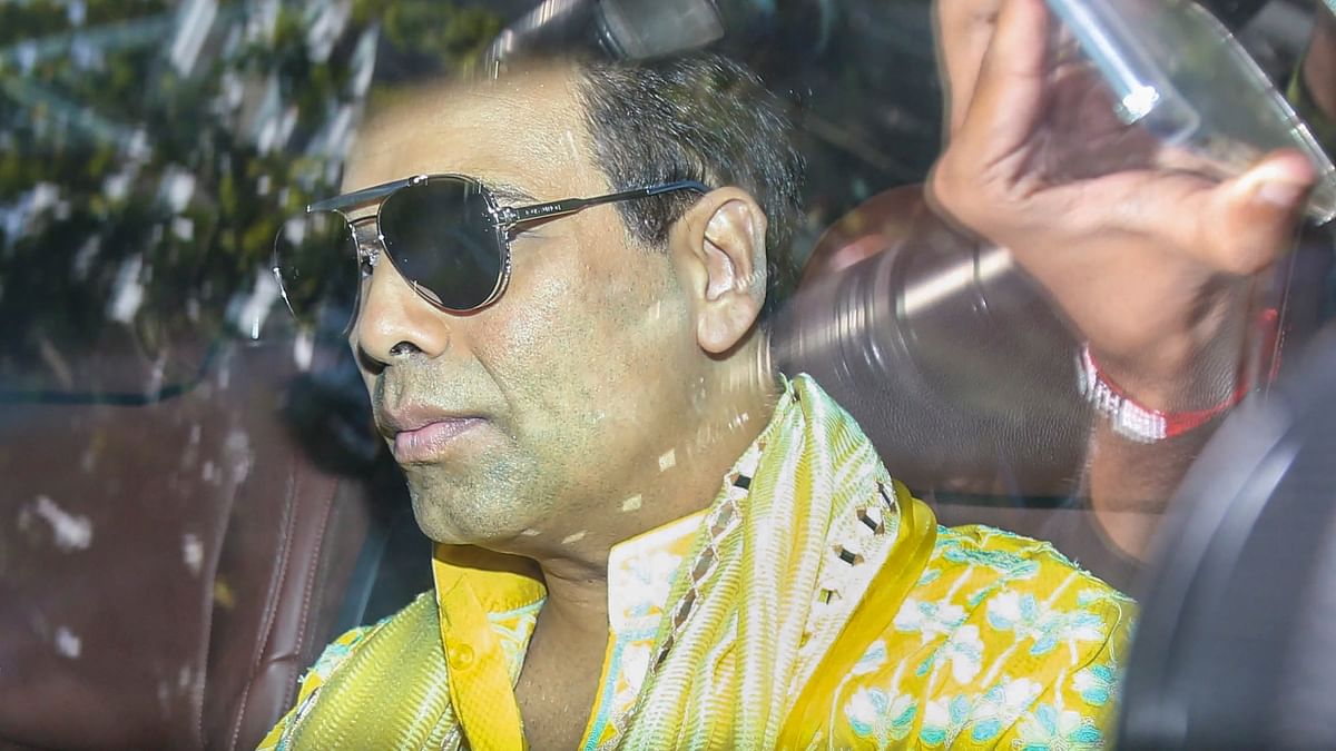Ace filmmaker Karan Johar arrives for Alia Bhatt's mehendi ceremony. Reportedly, he was the first to apply the henna to the actor's hands. Credit: PTI Photo