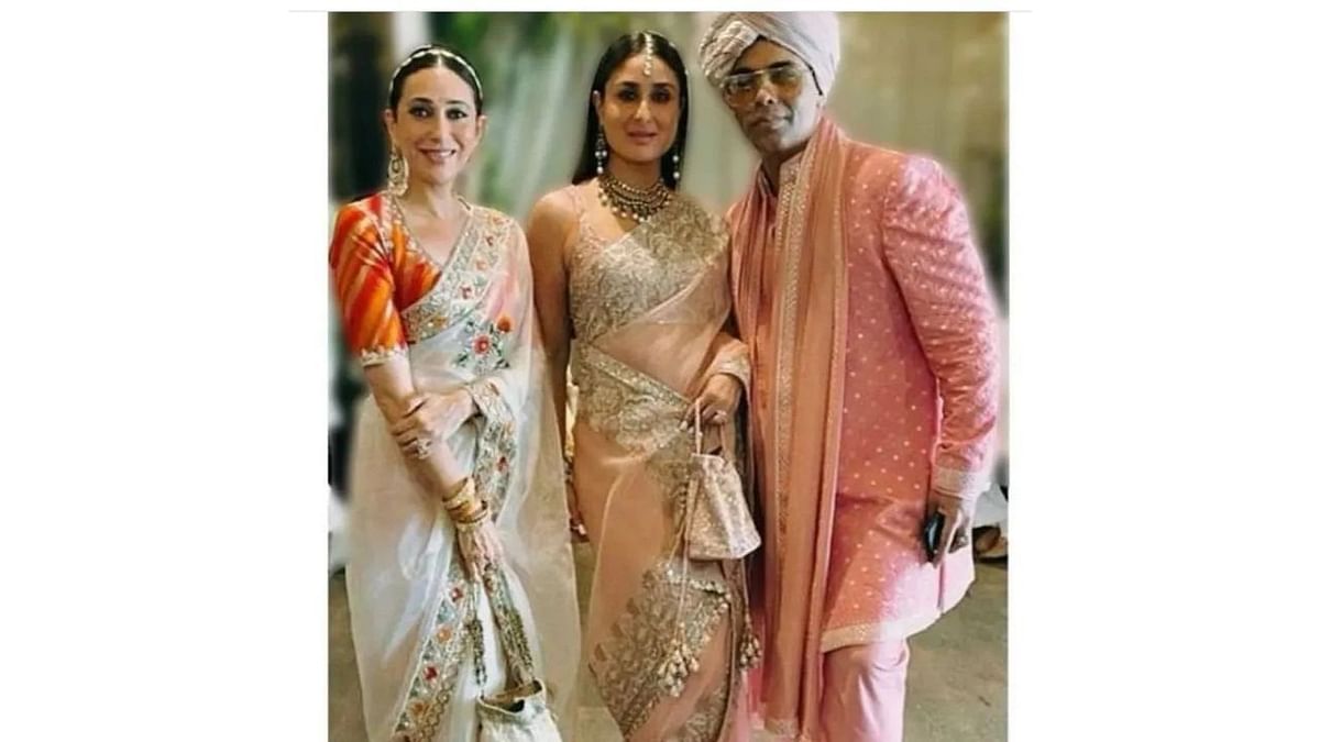 Karan Johar poses with Kareena and Karisma at Ranbir and Alia's wedding. Credit: Special Arrangement