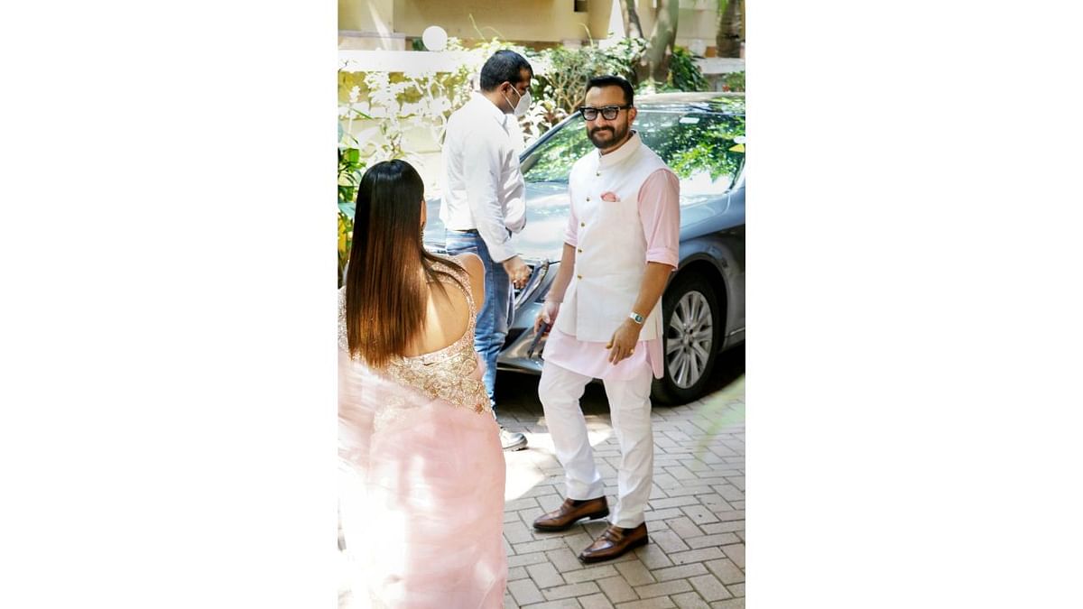 Celebrity couple Saif Ali Khan and Kareena Kapoor Khan get clicked on their arrival. Credit: PTI Photo