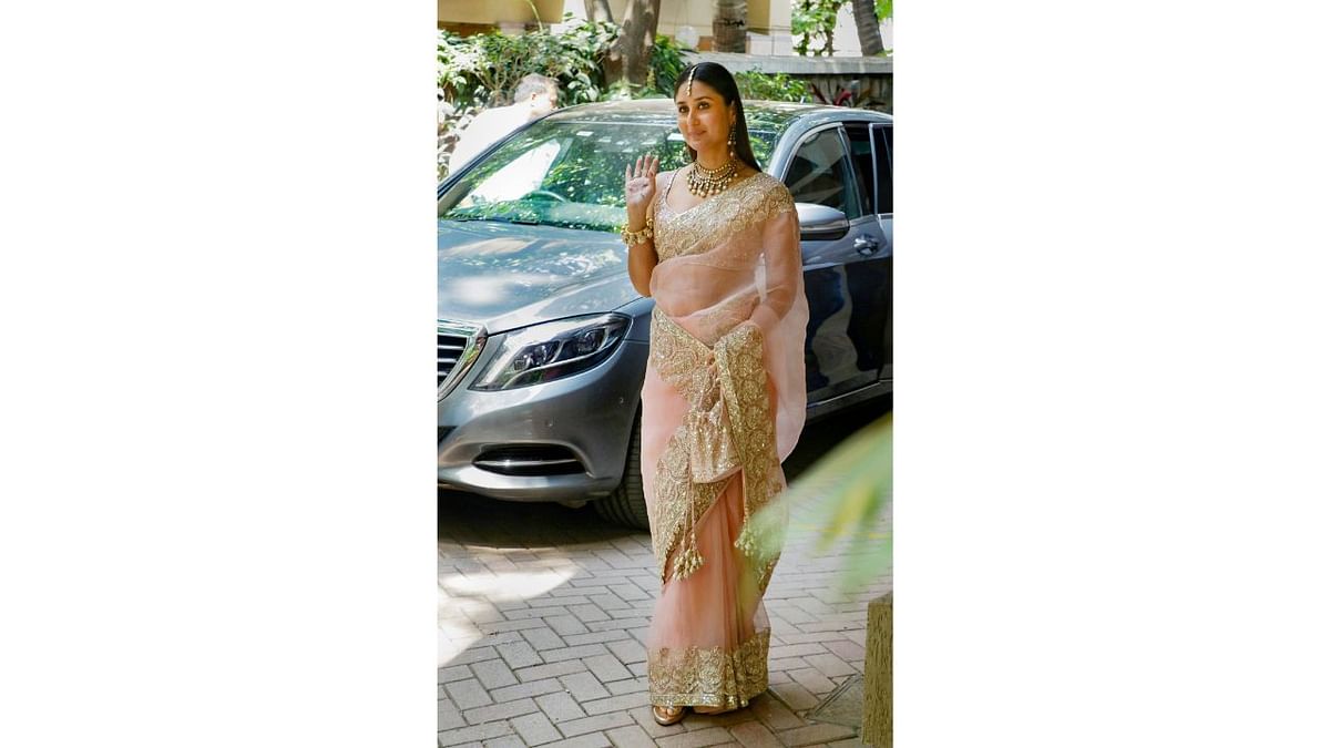 Kareena Kapoor poses for photos as she arrives for Ranbir Kapoor and Alia Bhatt's wedding, in Mumbai. Credit: PTI Photo