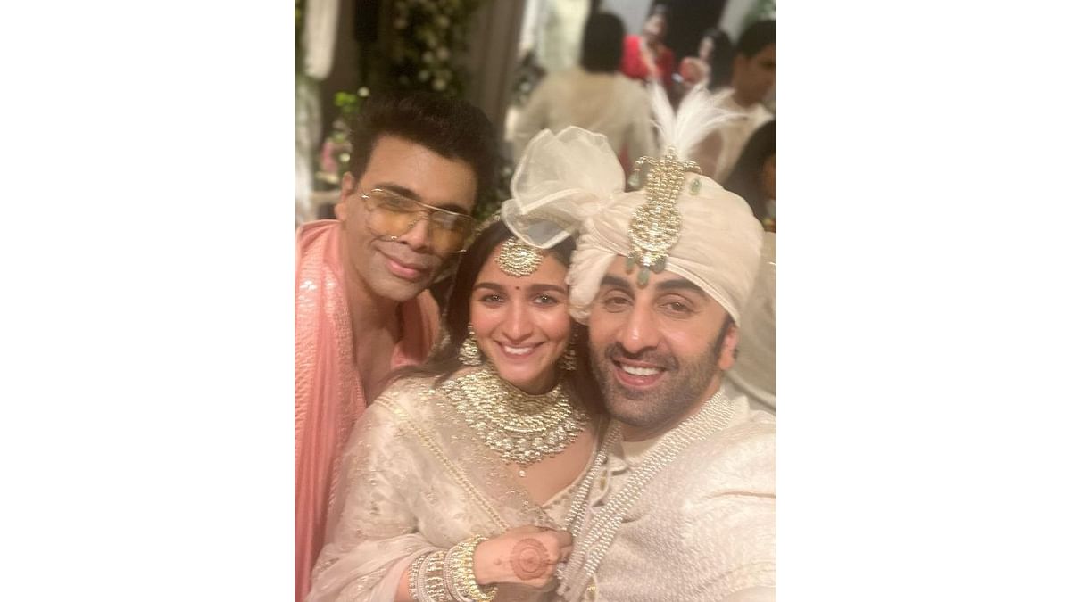 Karan Johar with the newlyweds Alia and Ranbir. Credit: Instagram/@karanjohar