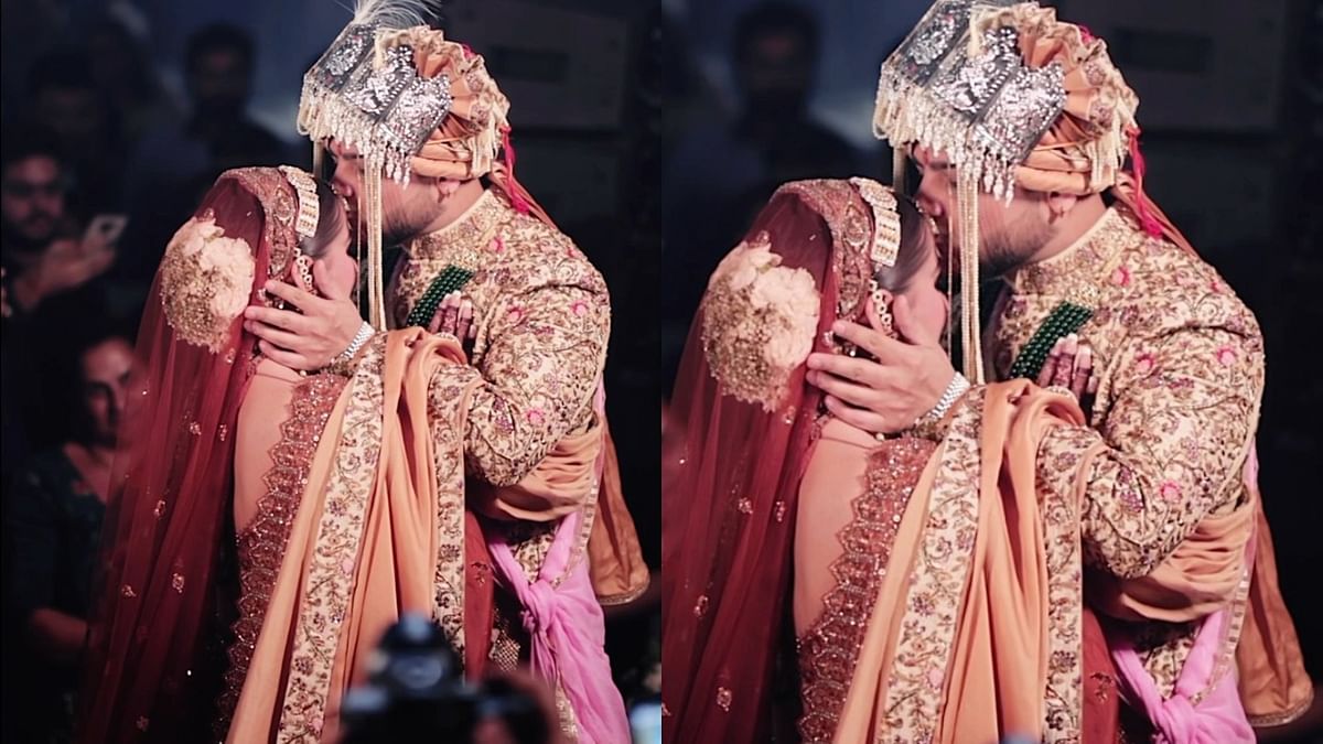 Millind Gaba plants a kiss on Pria Beniwal's forehead during their wedding. Credit: Dipak Studios