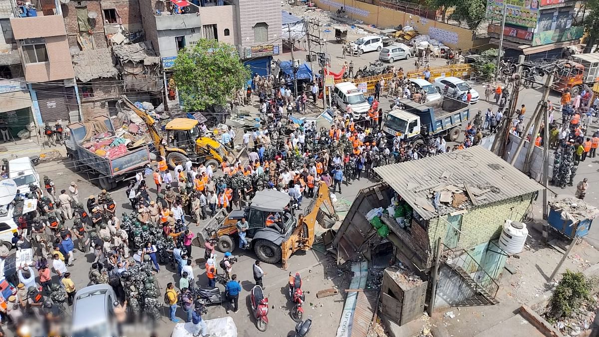 Bulldozers used to remove illegal structures during a joint anti-encroachment drive by NDMC, PWD, local bodies and the police, in the violence-hit Jahangirpuri area in New Delhi. Credit: PTI Photo