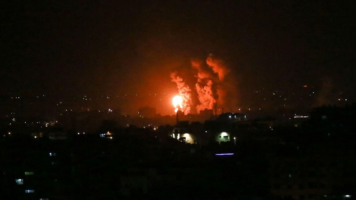 Flames and smoke rise during Israeli airstrikes central Gaza strip. Israeli jets struck Gaza in the early hours of April 21, witnesses and security sources said, hours after militants in the Palestinian enclave fired a rocket into the Jewish state. Credit: AFP Photo
